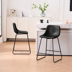 Set of 2 black counter and bar height stools styled at a kitchen island with modern decor