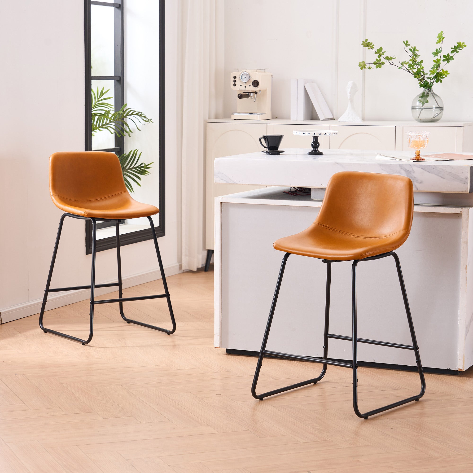 Set of 2 brown counter height and bar height stools with padded seats and metal legs, modern minimalist design