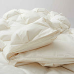 The down comforter is brushed in the pearly tones of off-white. Bring sophisticated elegance to your bedroom decor with this off-white bed comforter.