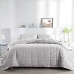 Lightweight light gray down blanket with 100% cotton cover and box quilting, featuring contrast piping and breathable comfort for year-round use