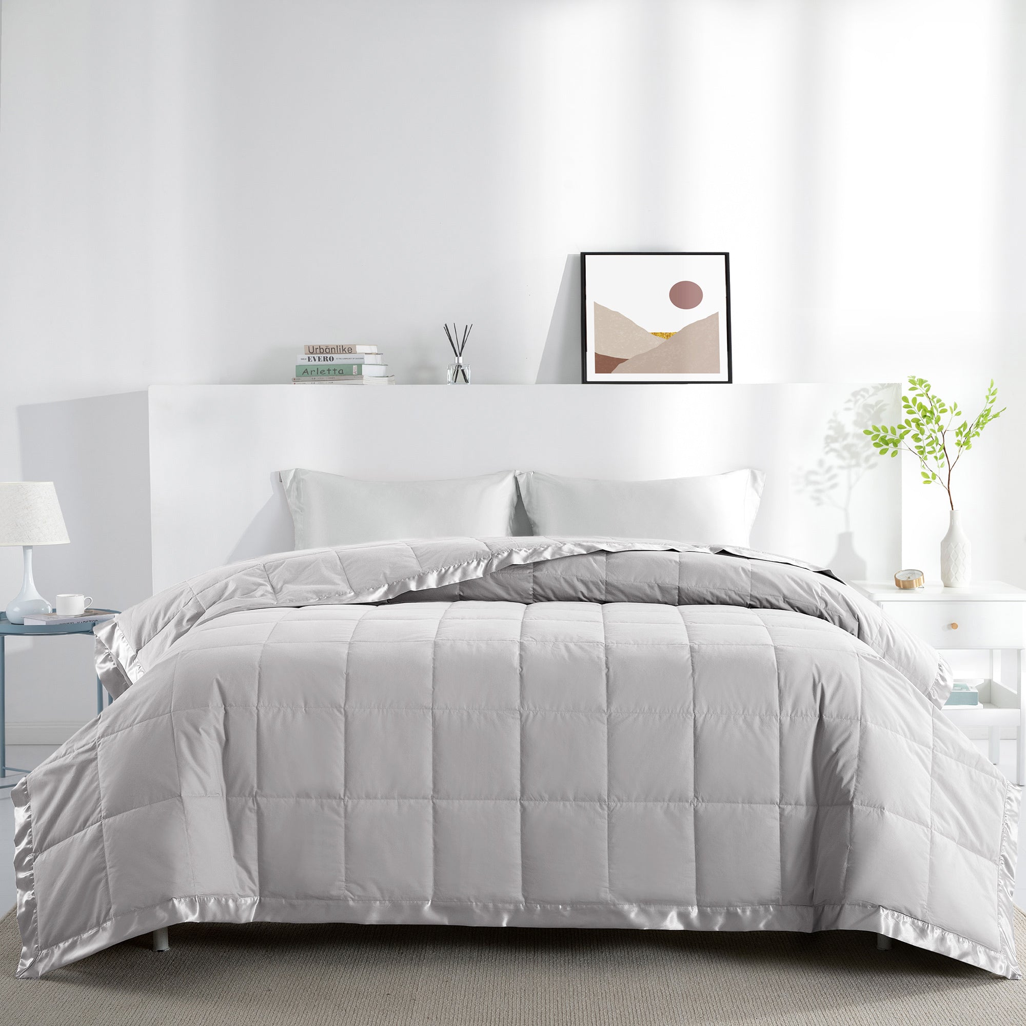 Lightweight light gray down blanket with 100% cotton cover and box quilting, featuring contrast piping and breathable comfort for year-round use