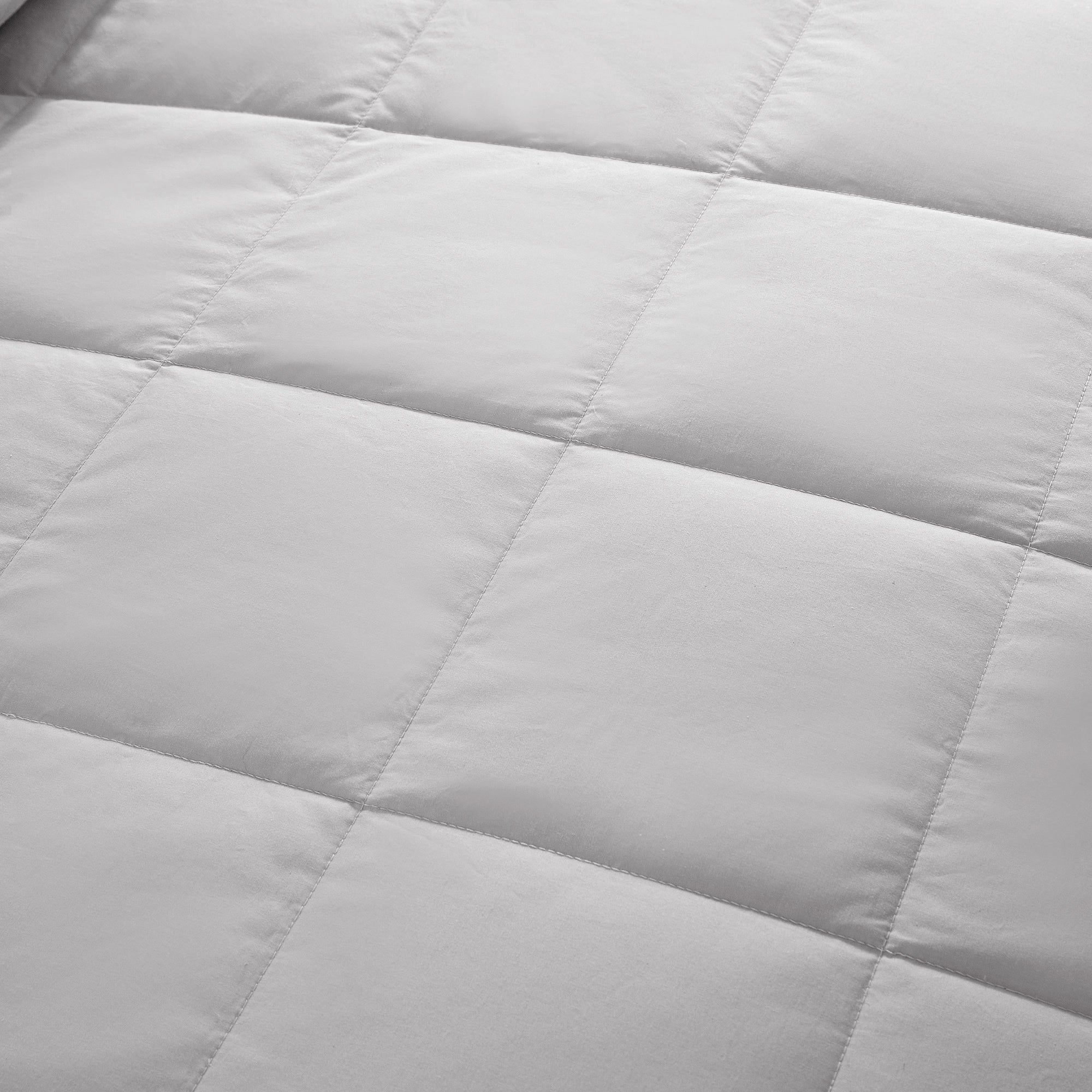Lightweight light gray down blanket with 100% cotton cover and box quilting, featuring contrast piping and breathable comfort for year-round use
