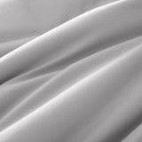 Lightweight light gray down blanket with 100% cotton cover and box quilting, featuring contrast piping and breathable comfort for year-round use