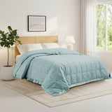 Lightweight winter sky down blanket with 100% cotton cover and box quilting, featuring contrast piping and breathable comfort for year-round use