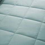 Lightweight winter sky down blanket with 100% cotton cover and box quilting, featuring contrast piping and breathable comfort for year-round use