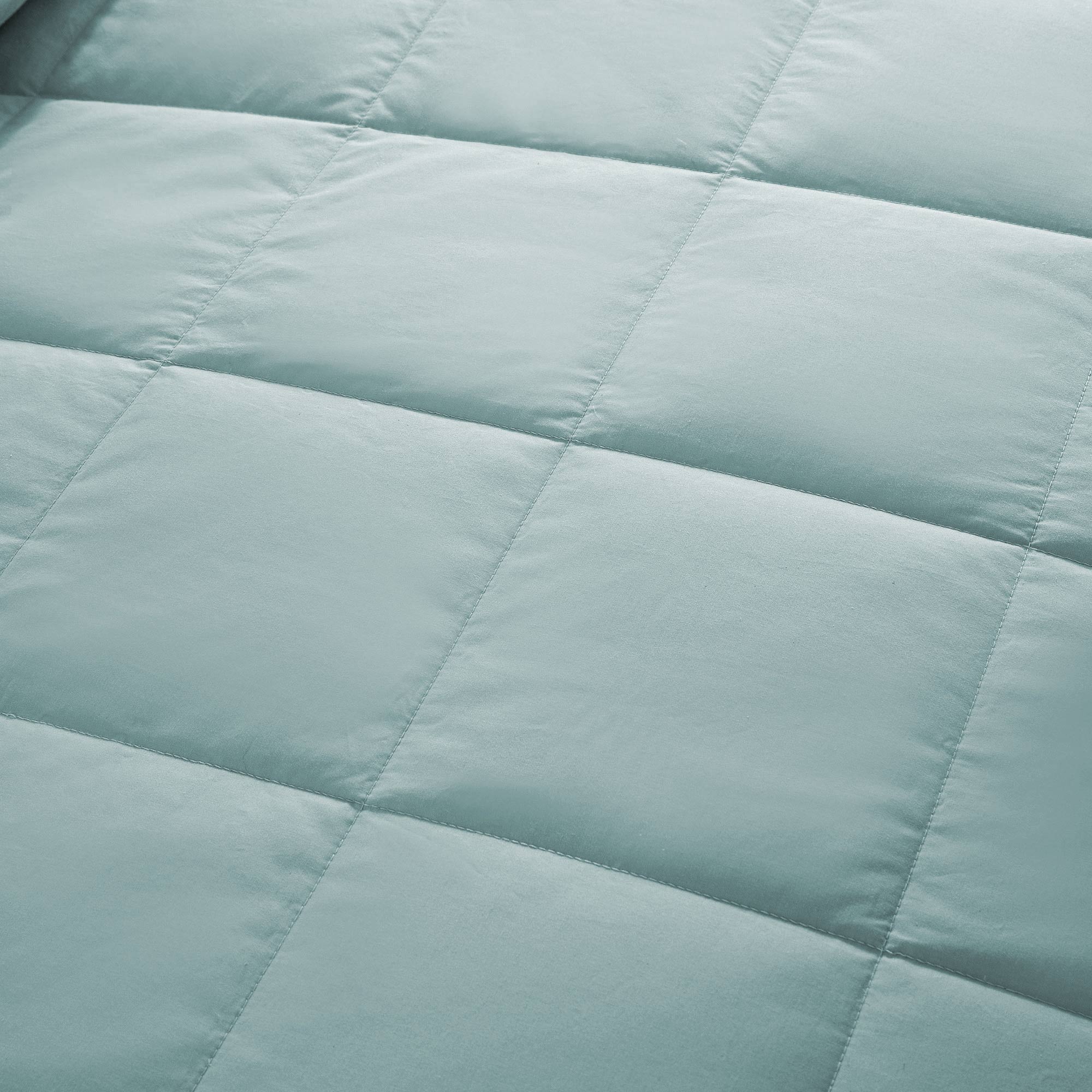 Lightweight winter sky down blanket with 100% cotton cover and box quilting, featuring contrast piping and breathable comfort for year-round use
