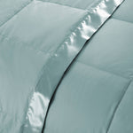 Lightweight winter sky down blanket with 100% cotton cover and box quilting, featuring contrast piping and breathable comfort for year-round use