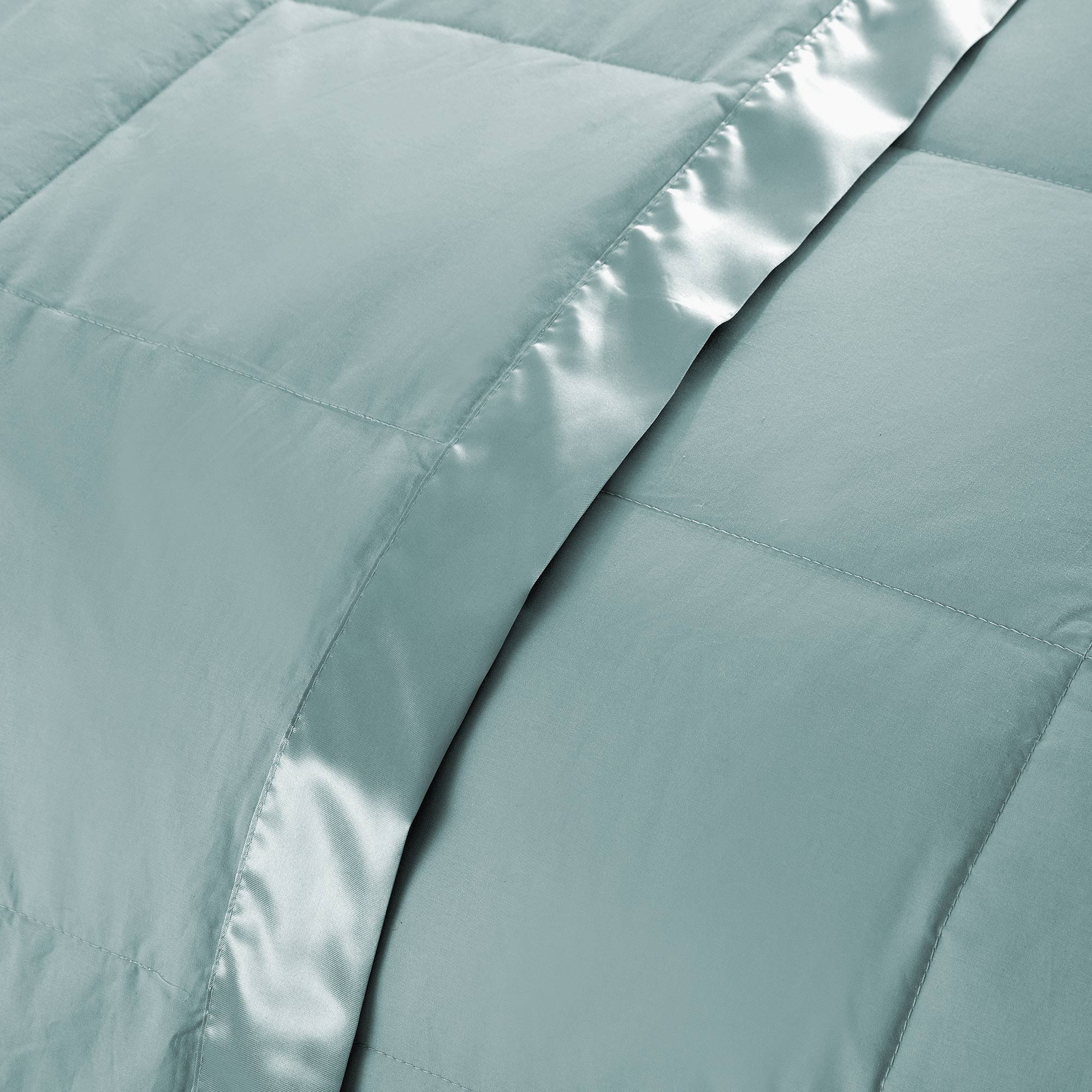 Lightweight winter sky down blanket with 100% cotton cover and box quilting, featuring contrast piping and breathable comfort for year-round use