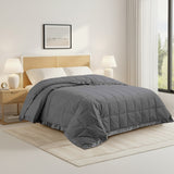 Lightweight dark gray down blanket with 100% cotton cover and box quilting, featuring contrast piping and breathable comfort for year-round use