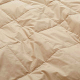 Lightweight pearled ivory down blanket with 100% cotton cover and box quilting, featuring contrast piping and breathable comfort for year-round use