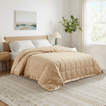 Lightweight pearled ivory down blanket with 100% cotton cover and box quilting, featuring contrast piping and breathable comfort for year-round use