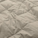 Lightweight vintaged khaki down blanket with 100% cotton cover and box quilting, featuring contrast piping and breathable comfort for year-round use