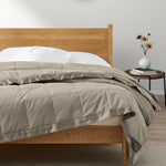 Lightweight vintaged khaki down blanket with 100% cotton cover and box quilting, featuring contrast piping and breathable comfort for year-round use