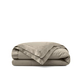 Lightweight vintaged khaki down blanket with 100% cotton cover and box quilting, featuring contrast piping and breathable comfort for year-round use