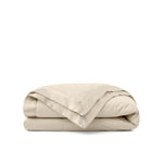 Lightweight caramel beige down blanket with 100% cotton cover and box quilting, featuring contrast piping and breathable comfort for year-round use