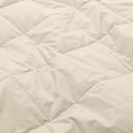 Lightweight caramel beige down blanket with 100% cotton cover and box quilting, featuring contrast piping and breathable comfort for year-round use
