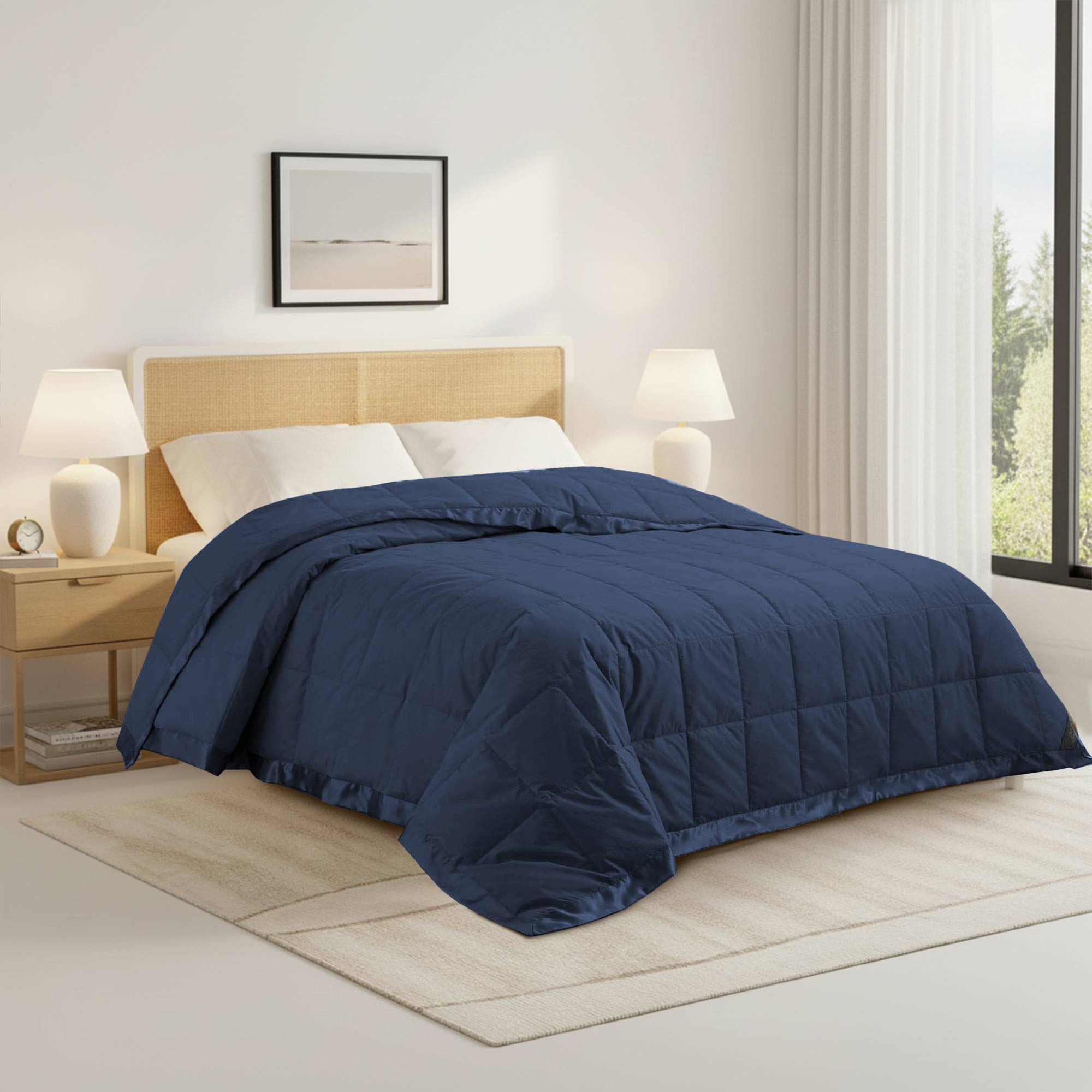 Lightweight navy down blanket with 100% cotton cover and box quilting, featuring contrast piping and breathable comfort for year-round use