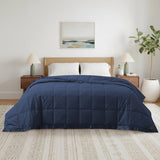 Lightweight navy down blanket with 100% cotton cover and box quilting, featuring contrast piping and breathable comfort for year-round use