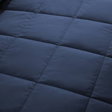 Lightweight navy down blanket with 100% cotton cover and box quilting, featuring contrast piping and breathable comfort for year-round use