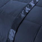 Lightweight navy down blanket with 100% cotton cover and box quilting, featuring contrast piping and breathable comfort for year-round use