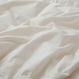 Crafted with a 100% organic cotton shell and filled with 90% natural white down, this comforter offers superior warmth and breathability. Its 800 fill power ensures a lightweight yet insulating sleep experience. Designed for year-round comfort, it features baffle box construction to maintain even fill distribution. Available in all-season and extra warm options, this comforter combines eco-friendly materials with luxurious softness for a restful night's sleep.
