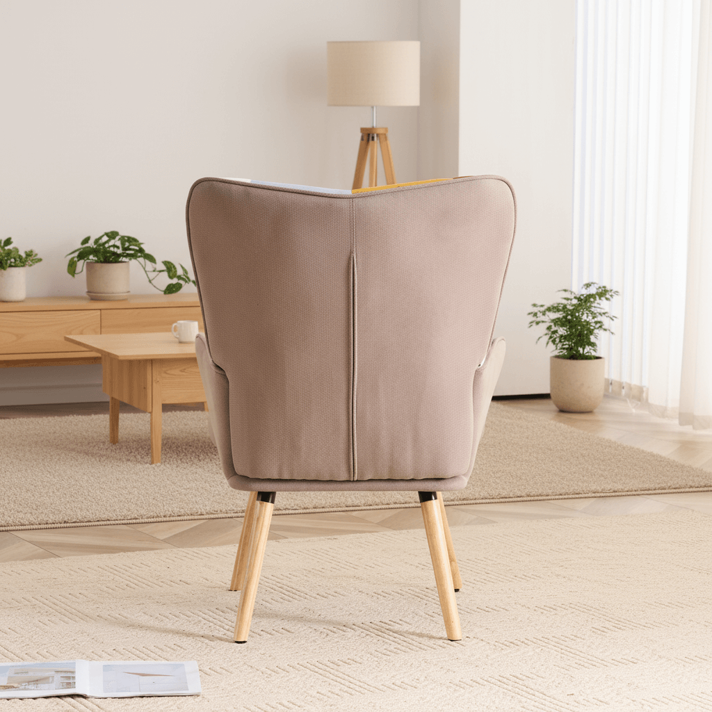 Back view of patchwork accent armchair showing smooth fabric back and solid wood legs