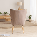 Back view of patchwork accent armchair showing smooth fabric back and solid wood legs
