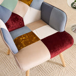Detailed view of jacquard patchwork fabric with multicolor panels on accent chair upholstery