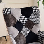Close-up of gray and black jacquard patchwork upholstery on the tufted backrest of the accent chair