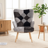 Gray and black patchwork accent chair with tufted back and cushioned seat, styled in a bright living space