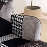 Close-up of padded armrest with gray and black patchwork fabric upholstery on accent chair