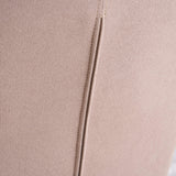 Close-up of smooth solid-color fabric on the back of the patchwork accent armchair