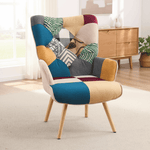 Colorful patchwork accent chair with tufted back and cushioned seat, styled in a modern living space
