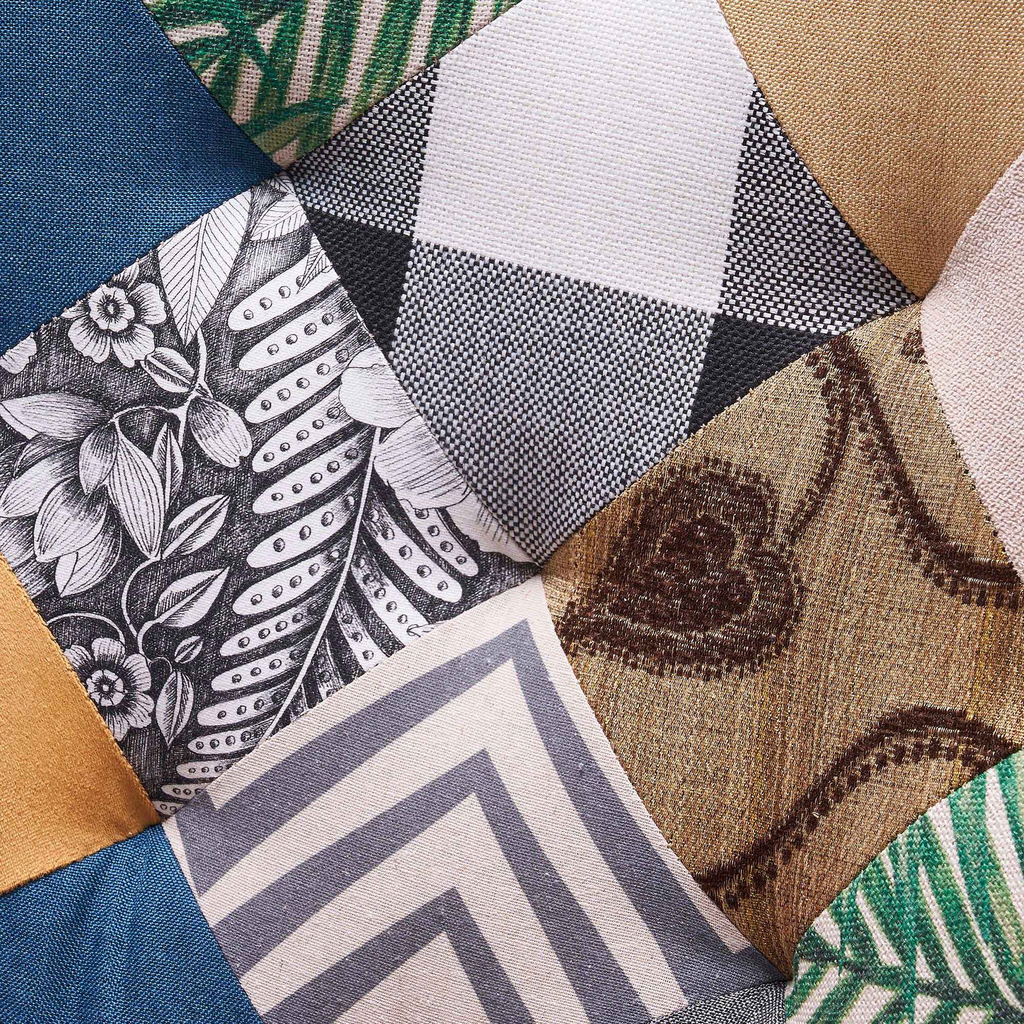Detailed view of jacquard patchwork upholstery on the tufted backrest of the accent chair
