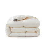 Crafted with a 100% organic cotton shell and filled with 90% natural white down, this comforter offers superior warmth and breathability. Its 800 fill power ensures a lightweight yet insulating sleep experience. Designed for year-round comfort, it features baffle box construction to maintain even fill distribution. Available in all-season and extra warm options, this comforter combines eco-friendly materials with luxurious softness for a restful night's sleep.